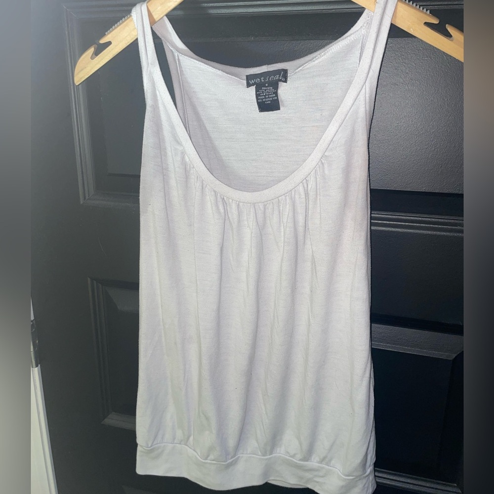 WET SEAL White tank top. Band at the bottom and supported straps around shoulder